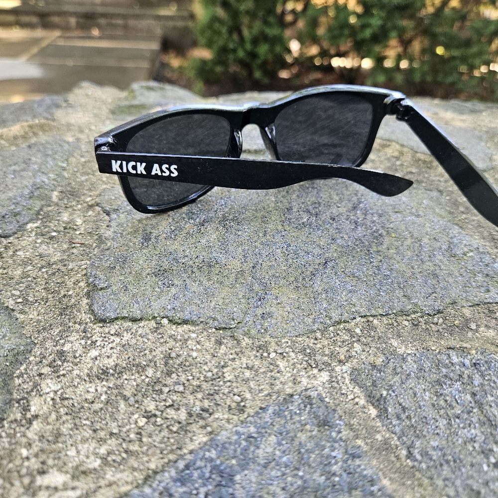 Black 🕶 Sunglasses with Bold Text. " Chew Bubblegum And Kick Ass."  🎬